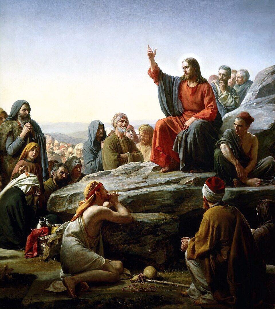 Carl Bloch, "The Sermon on the Mount" (19th century). Christ sits not upon a throne but on a hillside, and around him is not a crowd but a multitude of distinct faces: a praying woman with a child, an old man, a beggar with a bowl at his feet. The artist refused to paint the mass — he painted the Kingdom as an address to each one separately.